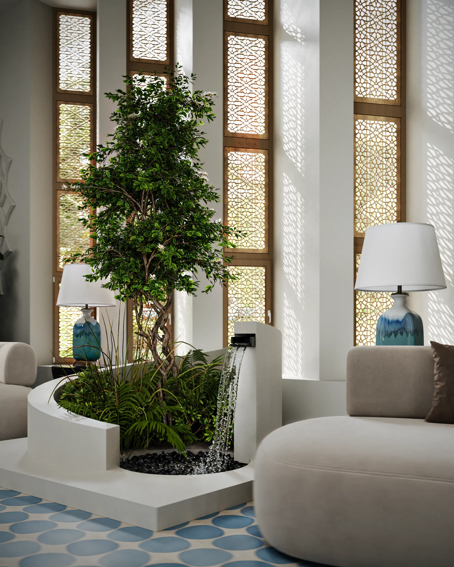 Indoor fountain with plants near the sofa area in a lobby.