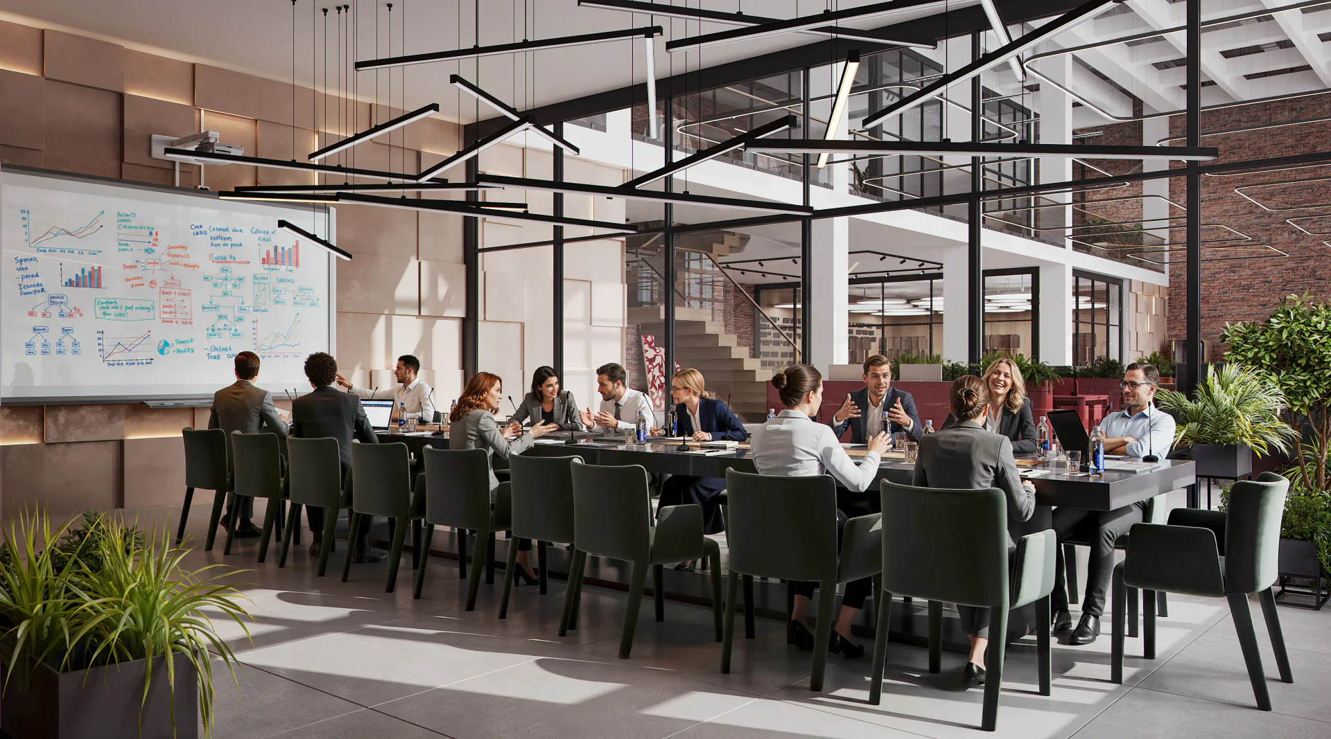 Professionals discussing business in a modern conference room with a large equipped table.