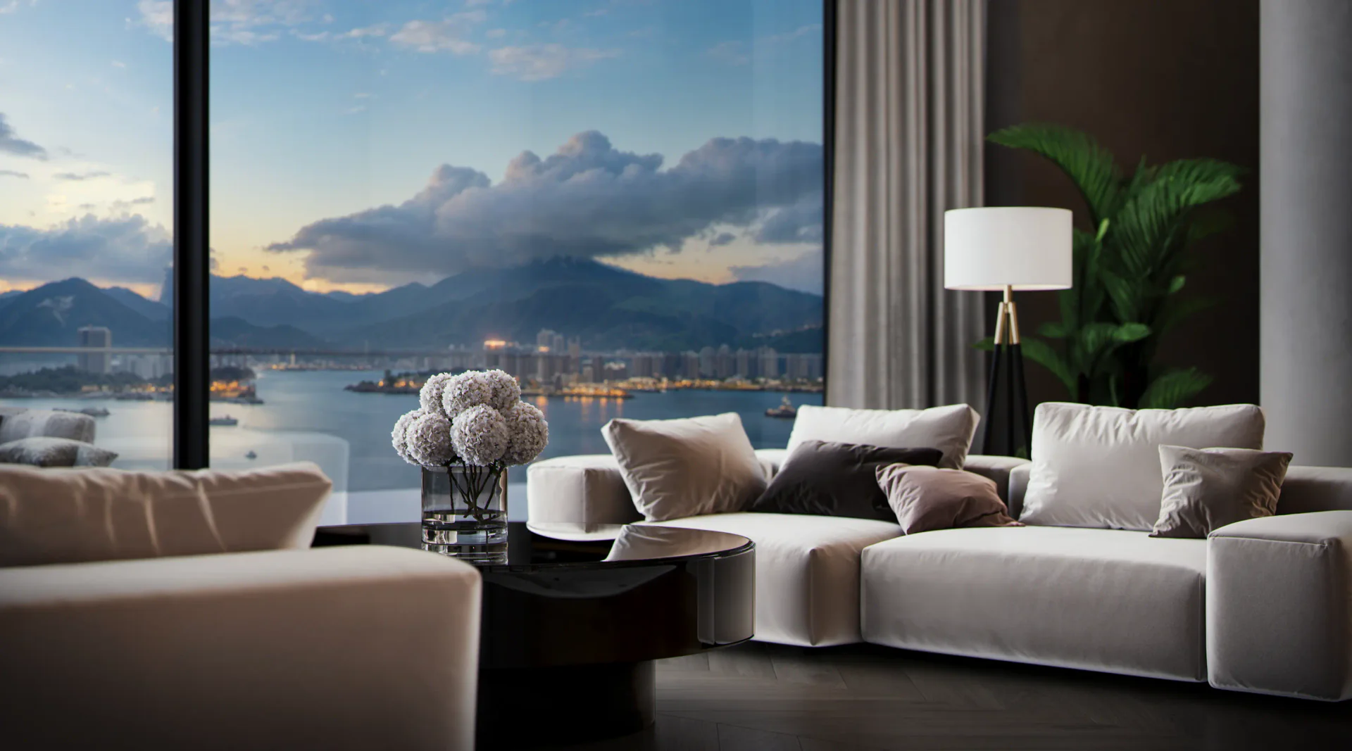 Close-up of a sophisticated sofa area, detailed with plush cushions and elegant decor items on a coffee table.