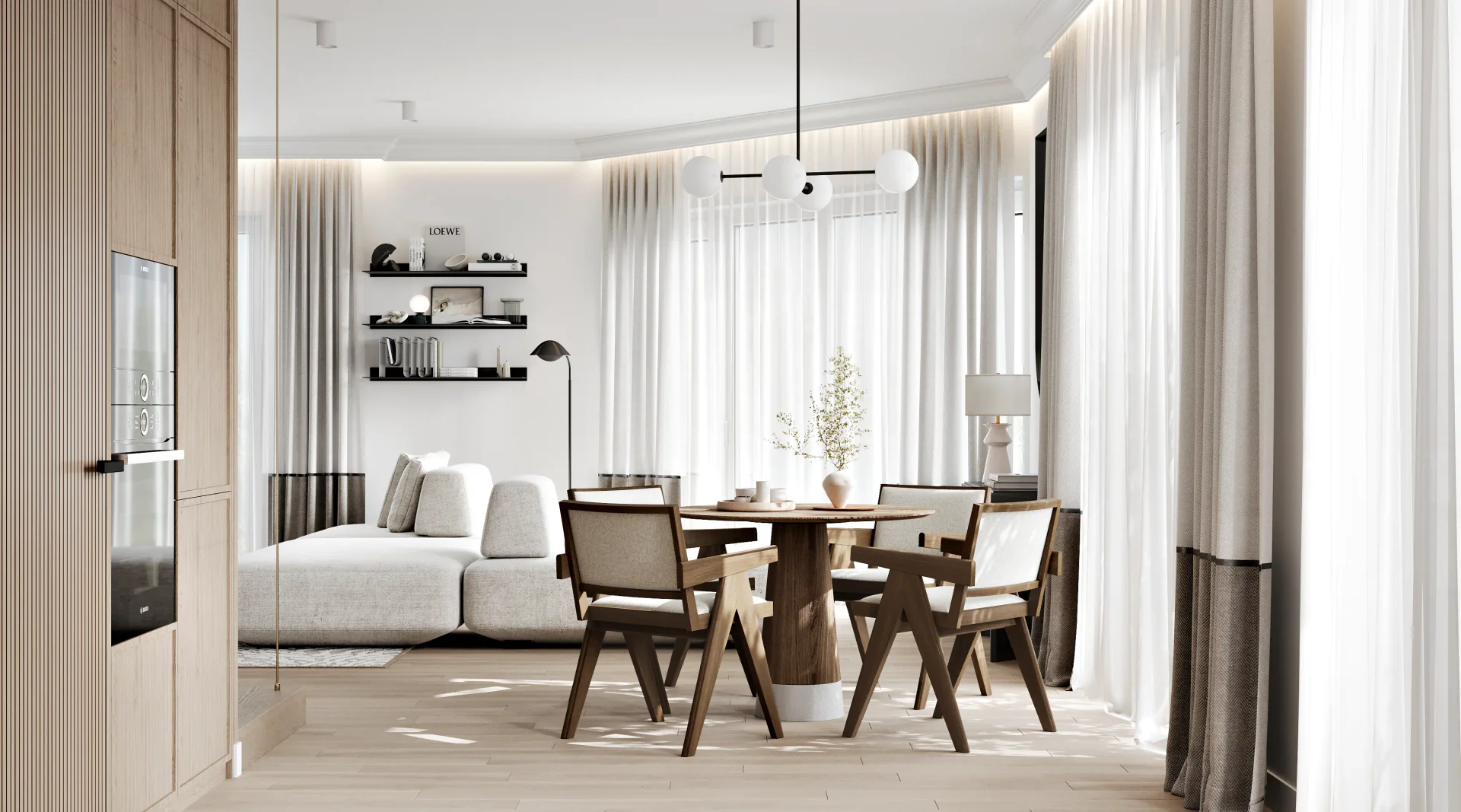 View from the modern kitchen overlooking the open-plan dining area and living room.