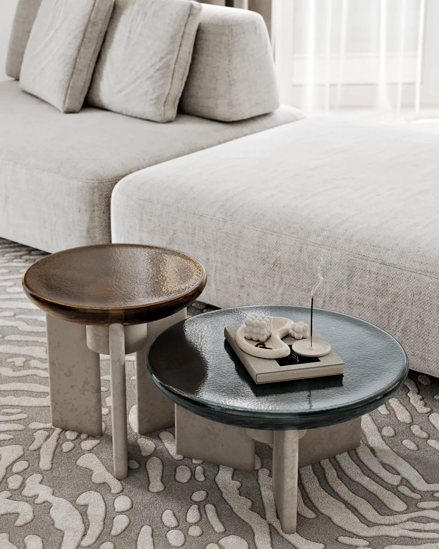 Detail shot of modern coffee tables with curated decorative items in a living room.