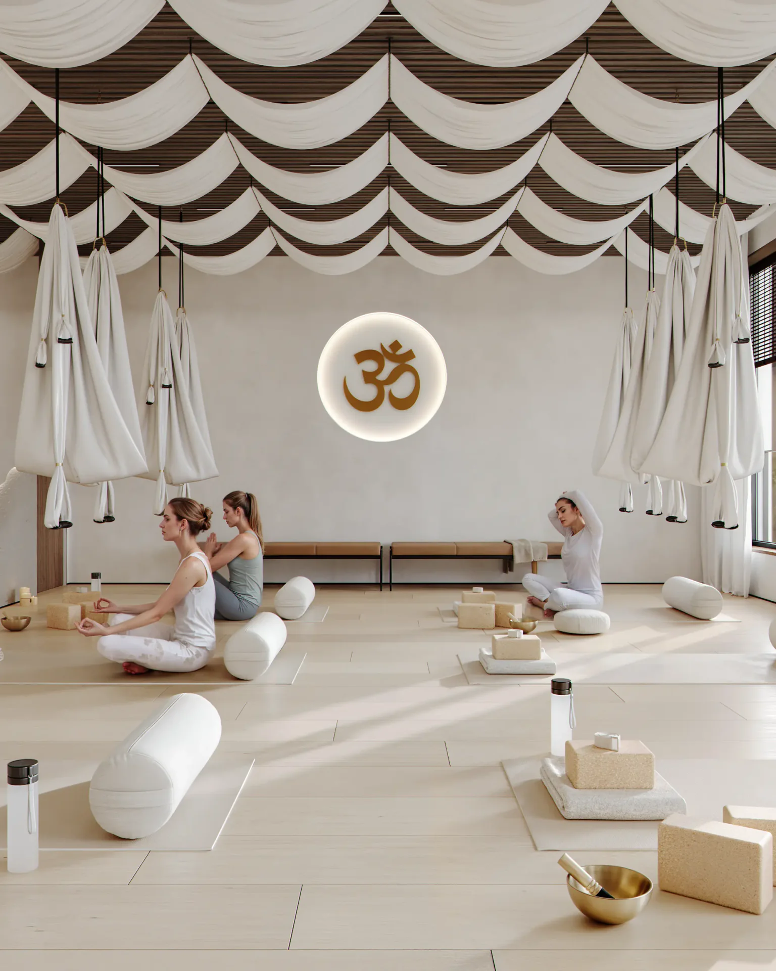 Yoga studio entrance with waiting benches, logo, and a view of the practice area.