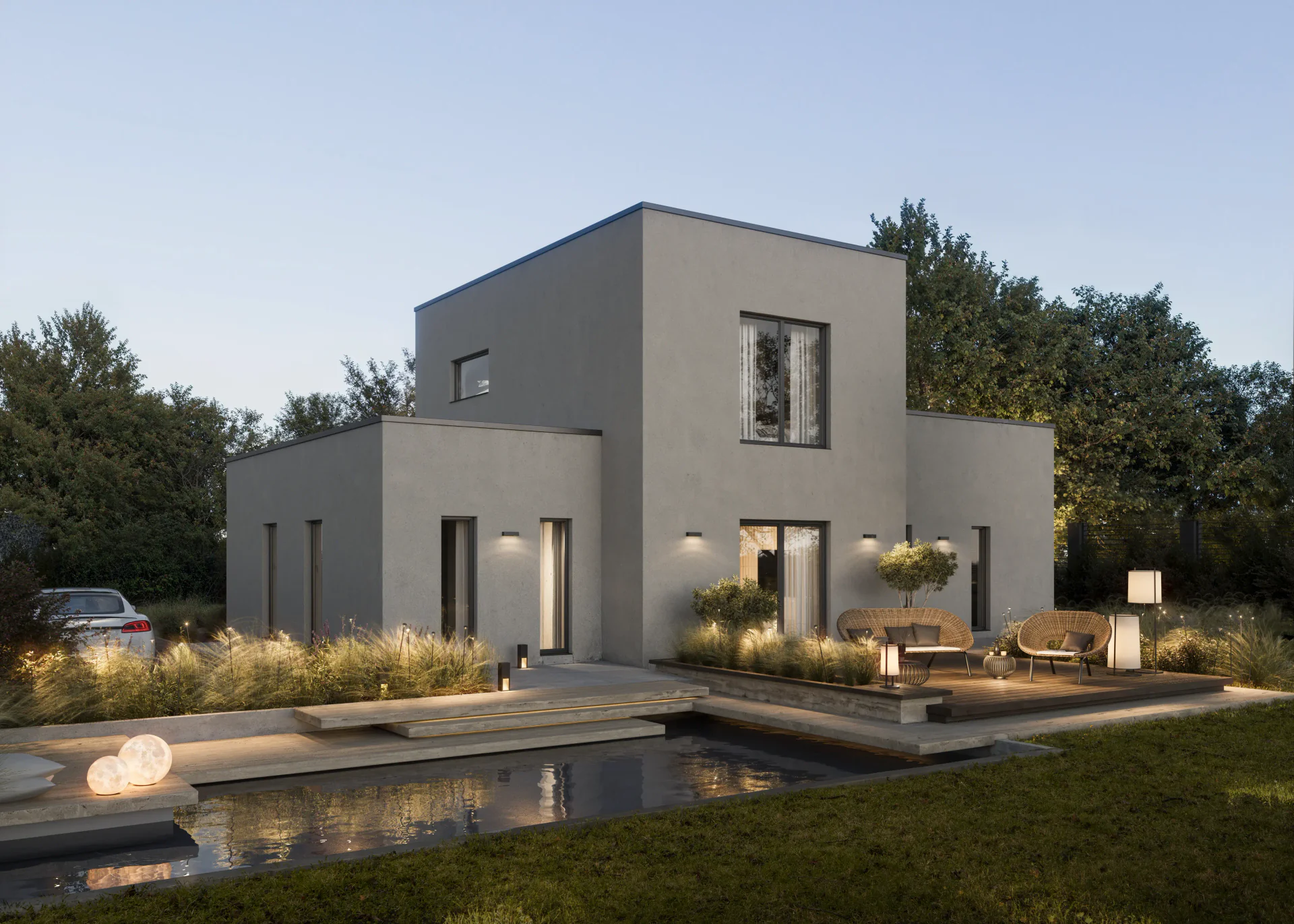 Evening view of a pool and terrace with atmospheric outdoor lighting.