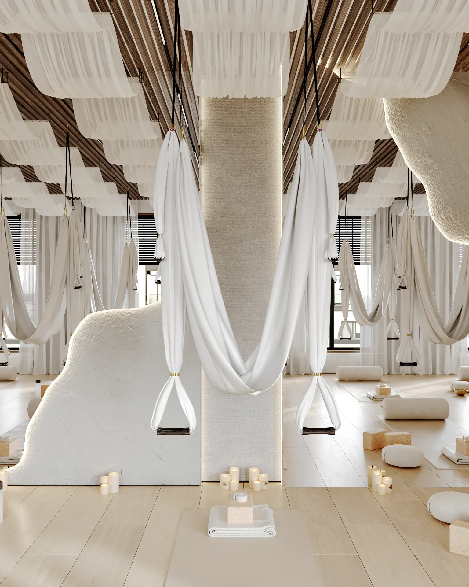 Serene spot for aerial yoga, featuring a single hammock by a large mirror.