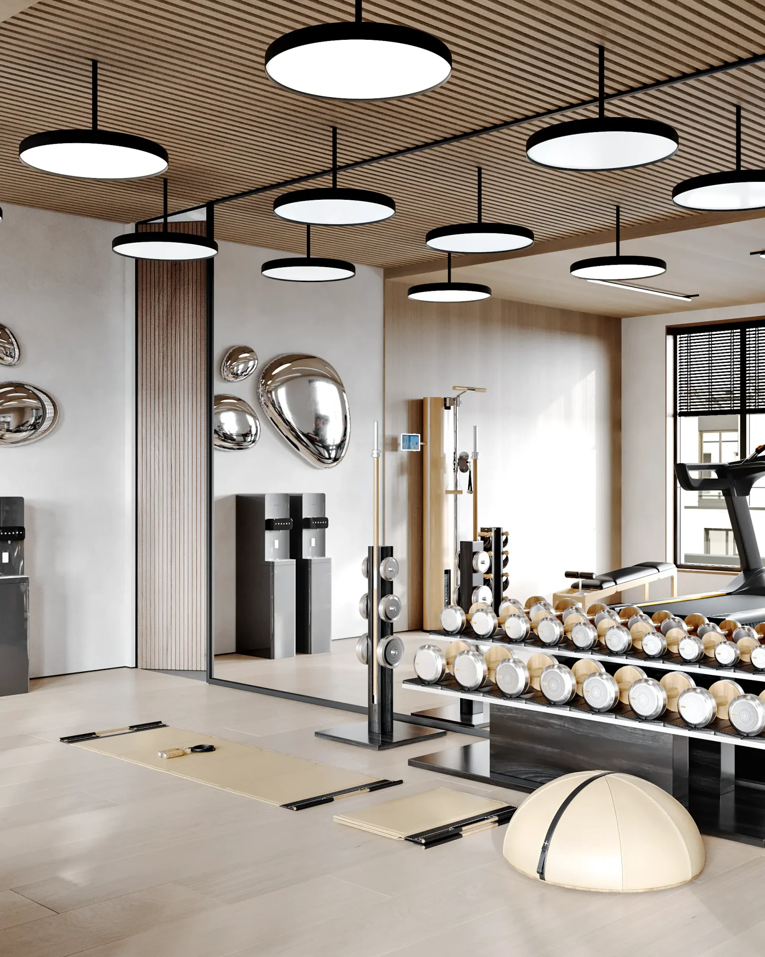 Gym hydration station next to a dumbbell rack and a large mirror.