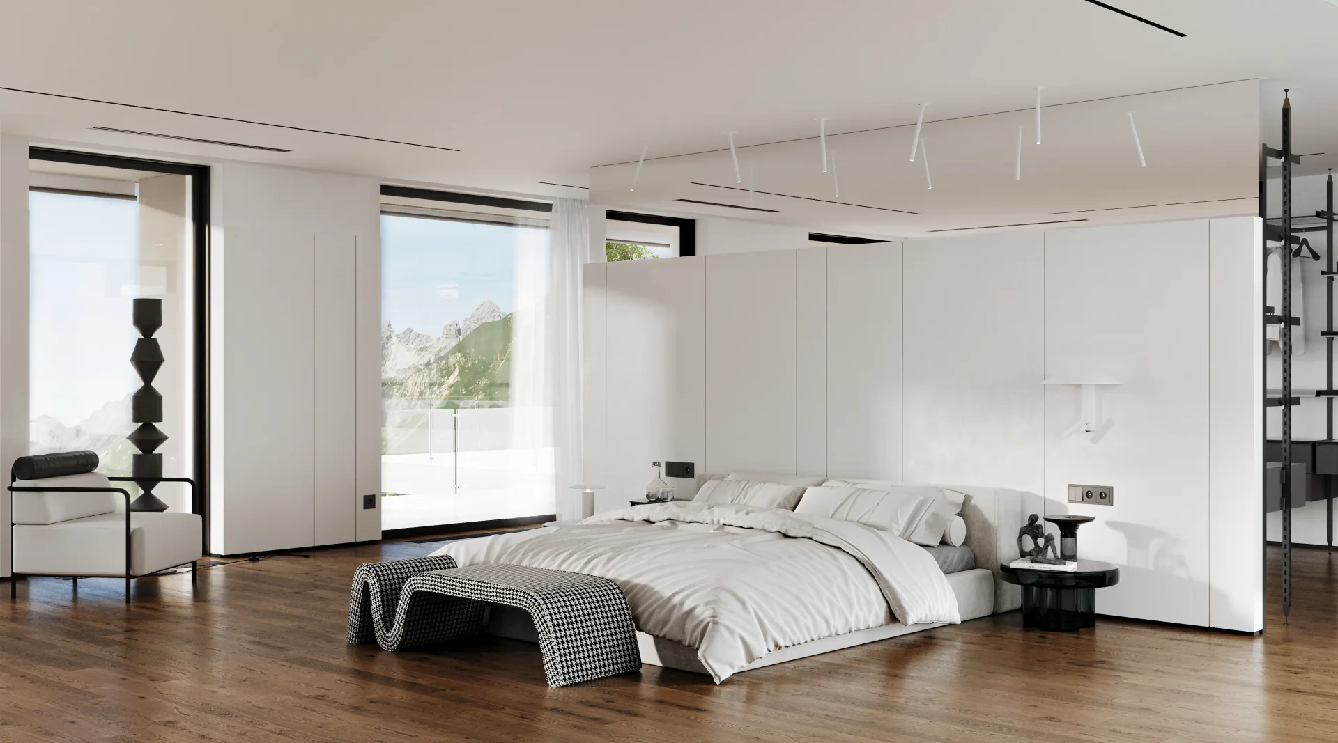 Spacious modern bedroom featuring a main bed, a cozy reading nook, and the entrance to a walk-in closet.