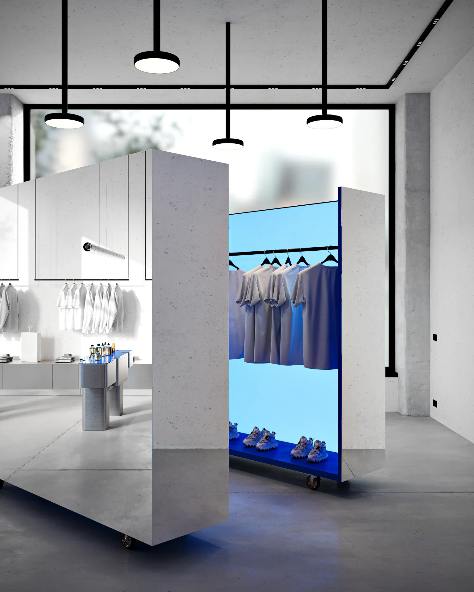 Minimalist retail shelving displaying a curated collection of clothing and footwear.