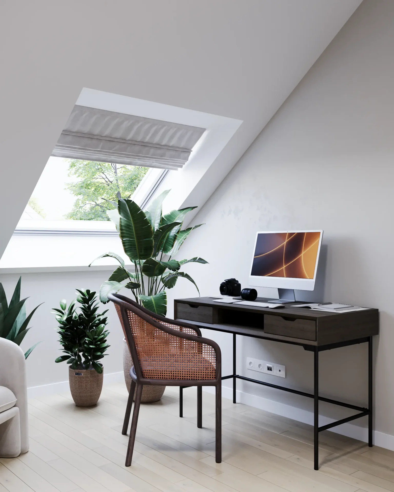 Workspace by the window with a computer, chair, and plants.