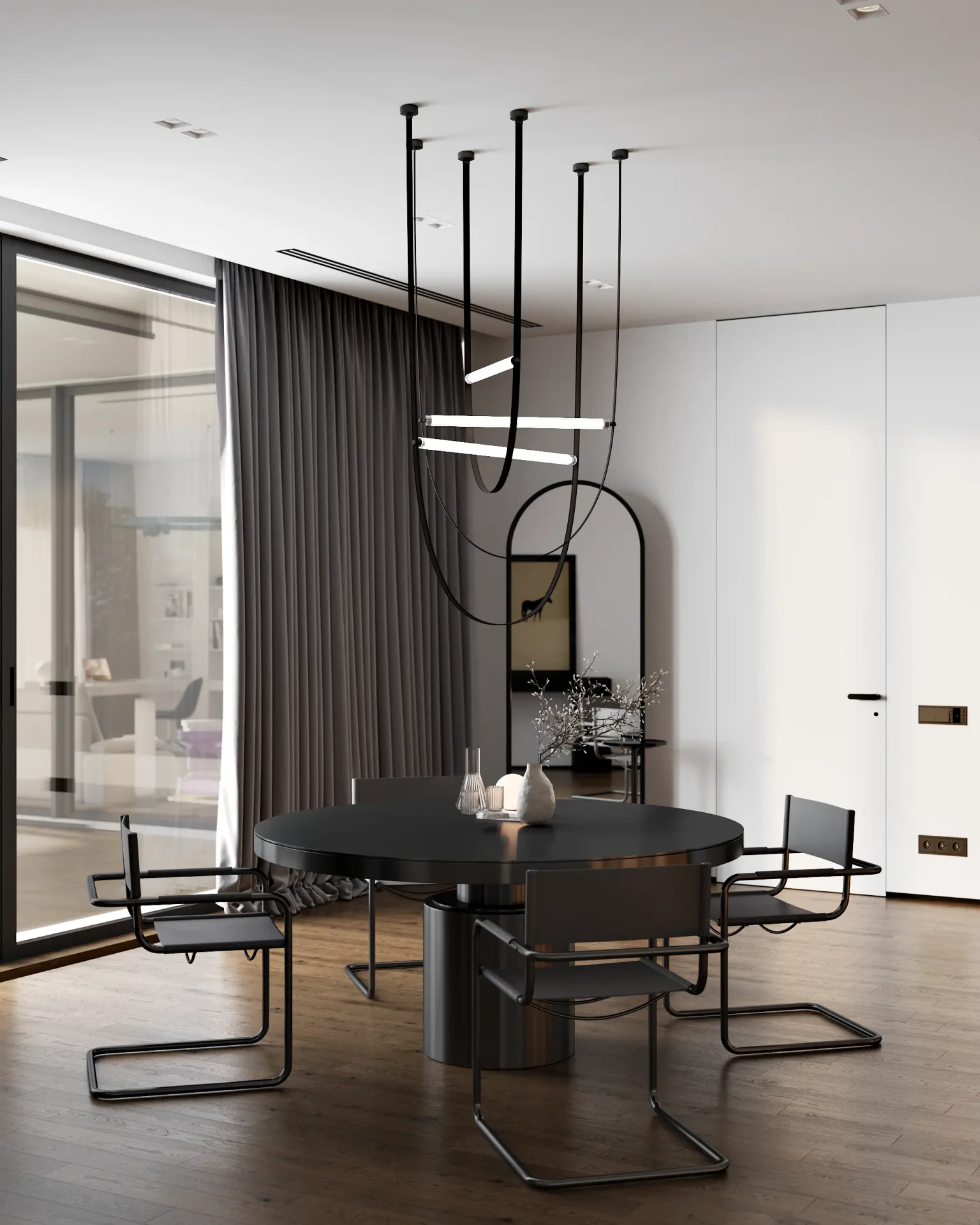 View of a modern dining table and chairs situated within the open-plan kitchen.