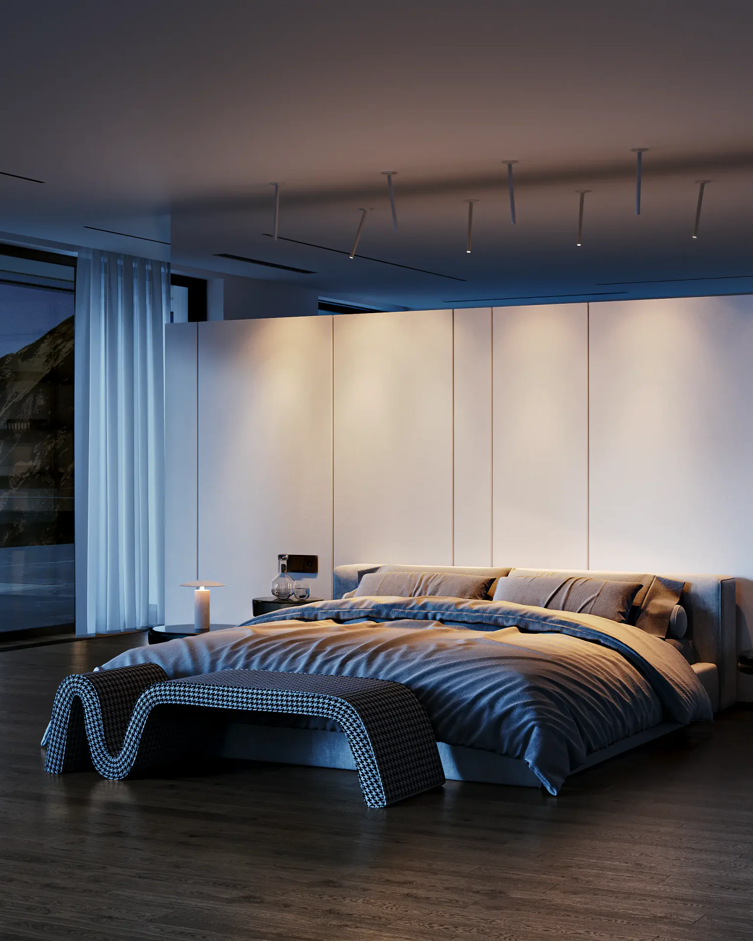 Atmospheric evening view of a modern bedroom, mixing cool natural light with warm interior lighting.