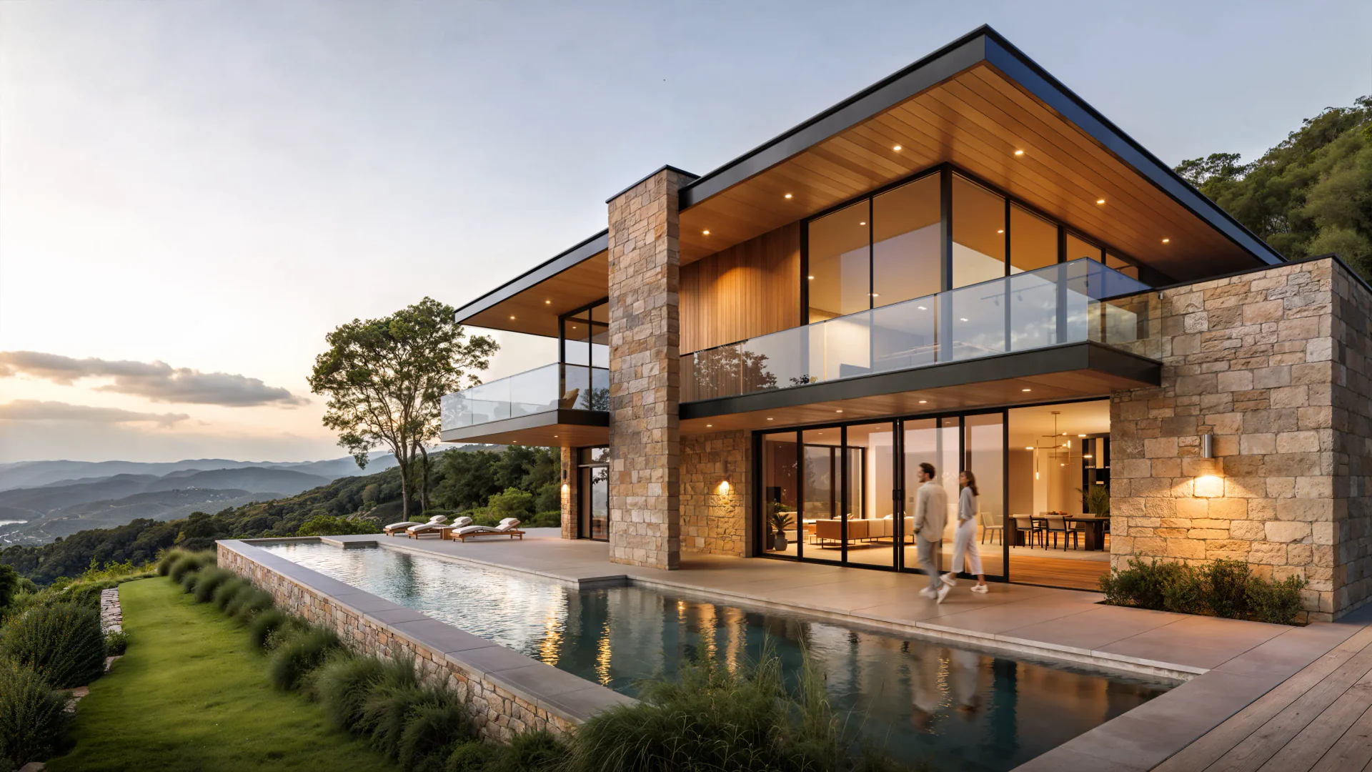 Luxury seaside villa at sunset with infinity pool, warm lighting, and walking couple