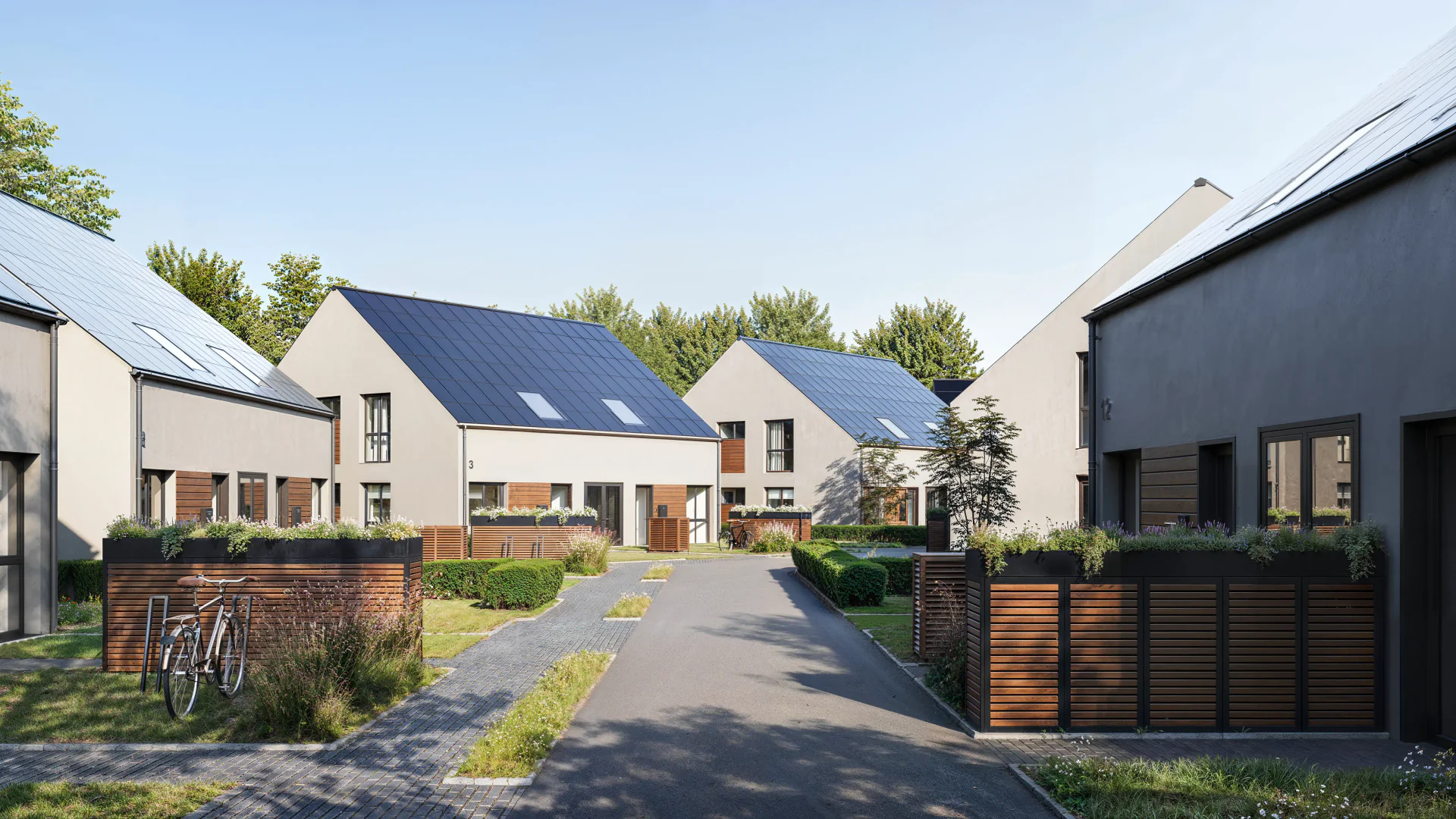 Front view of a residential complex and street.
