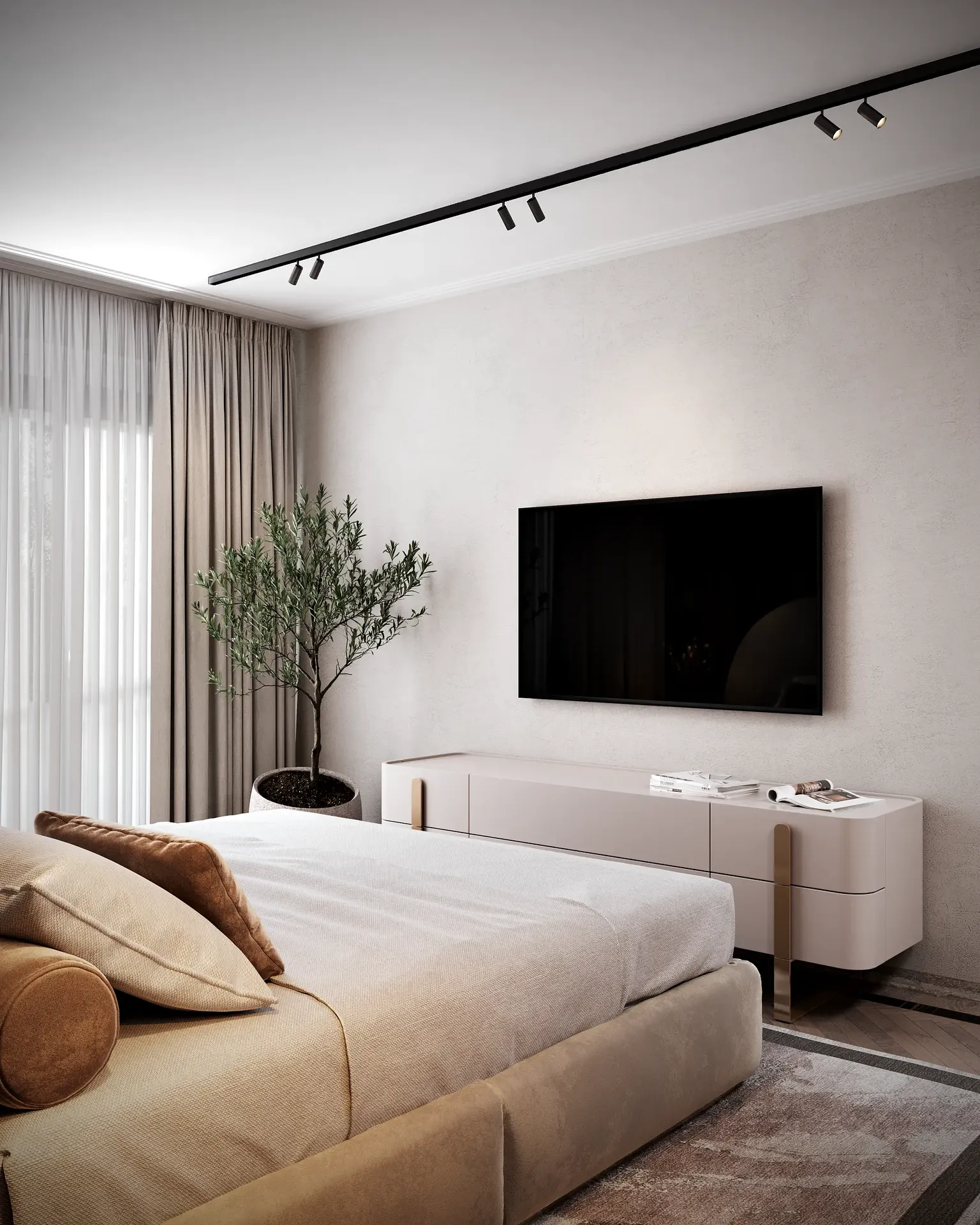 Vue d'angle de la chambre principale, montrant un téléviseur et une console muraux minimalistes.