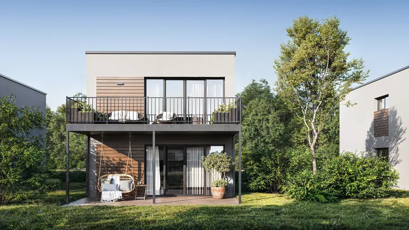 Vorderfassadenansicht eines Hauses mit begrüntem Terrassenbereich.