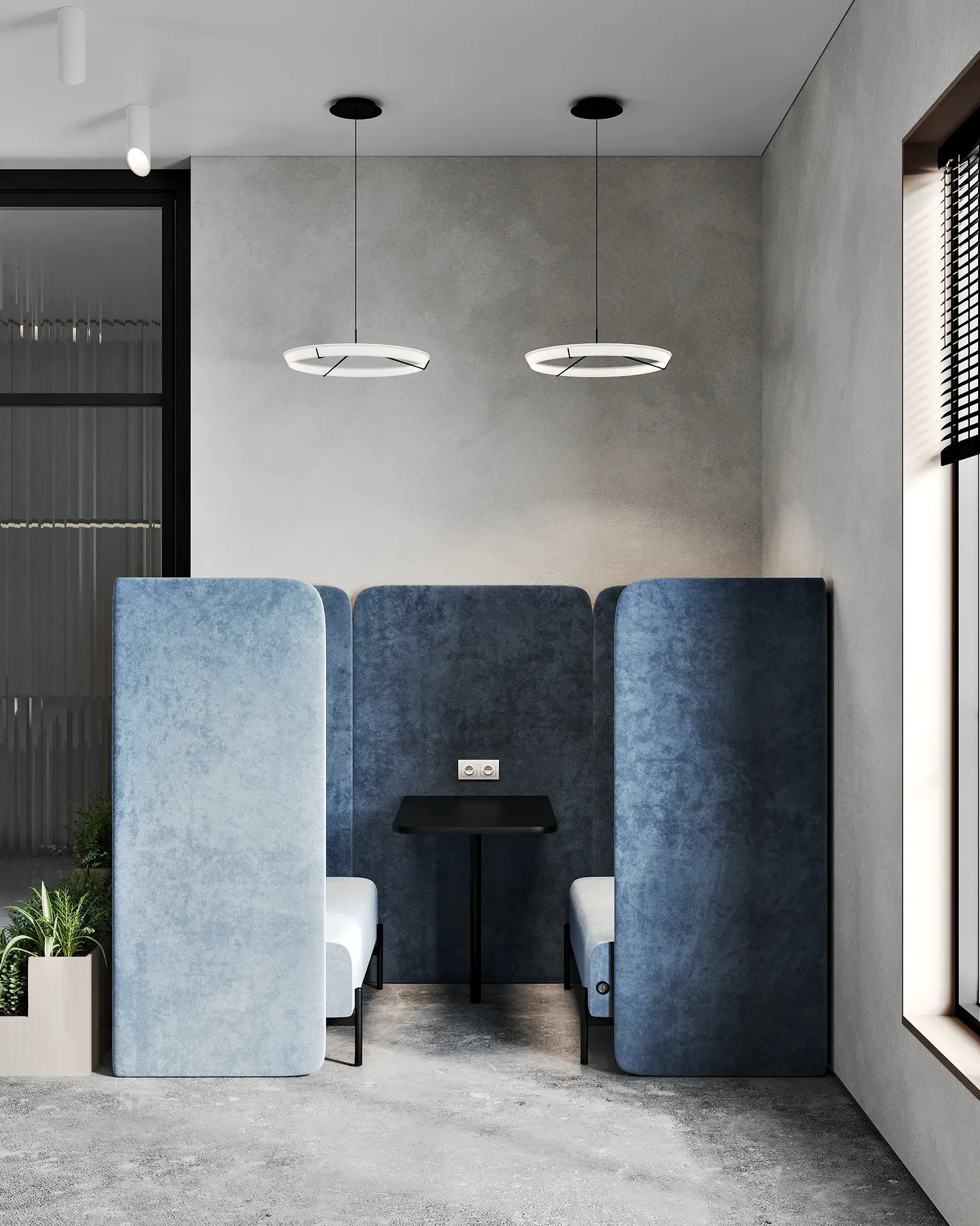 Vue frontale d'une cabine de réunion privée pour deux personnes, rembourrée en bleu.