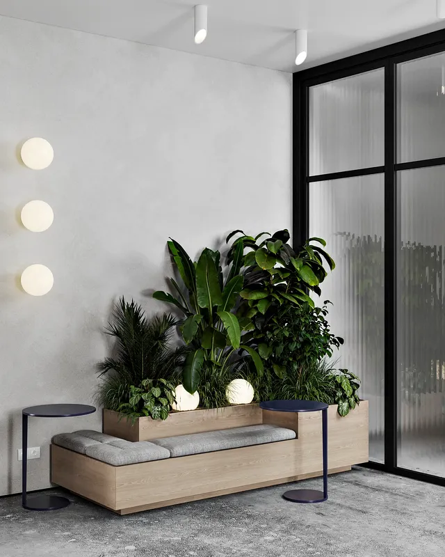 Salon de réception élégant avec des sièges confortables, des tables basses et un élégant décor floral.