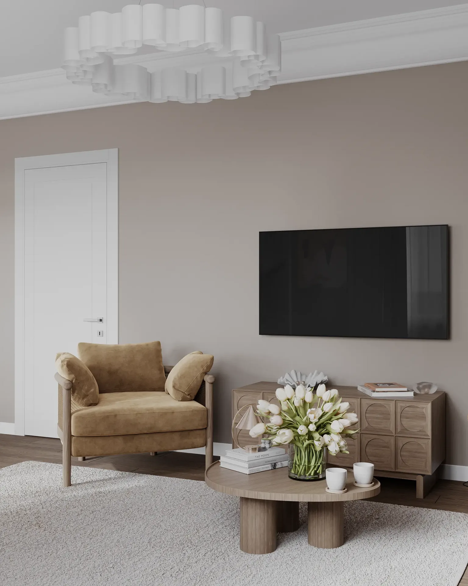 Vue en angle d'une zone TV avec une unité multimédia, un fauteuil et une entrée.