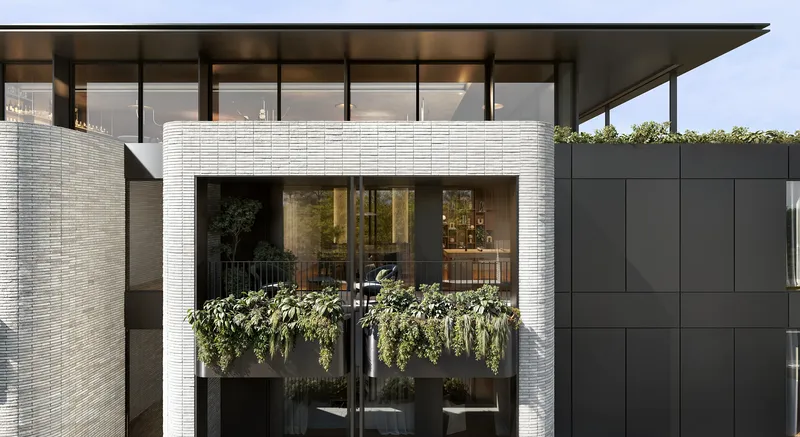 Gros plan d'un balcon décoré de plantes vertes.