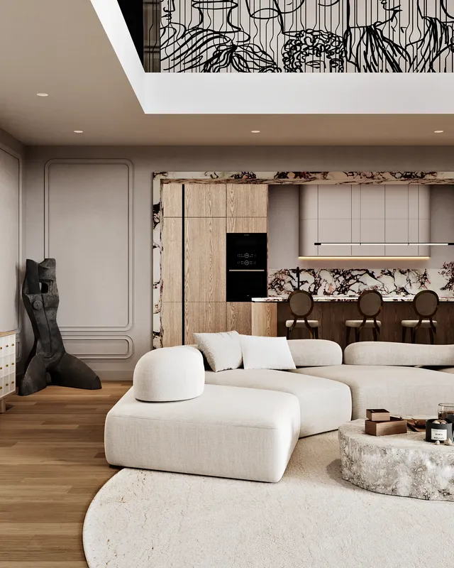 Vue reliant le coin canapé confortable à la cuisine en marbre élégante et moderne dans un espace à aire ouverte.