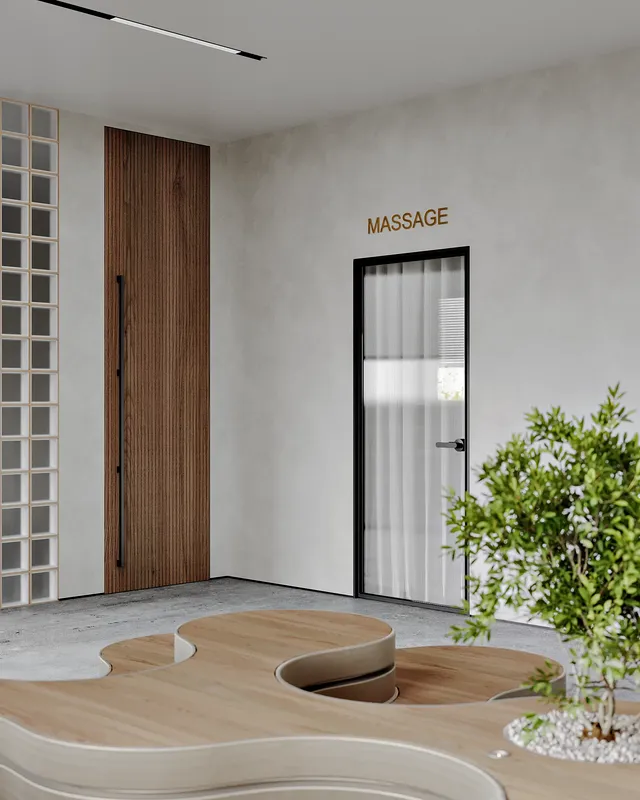 Vue du couloir montrant les entrées de la salle de massage et des vestiaires.