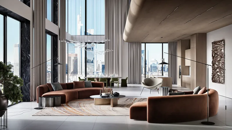 Vue du canapé d'un salon moderne, avec la table à manger et la cuisine en arrière-plan ouvert.