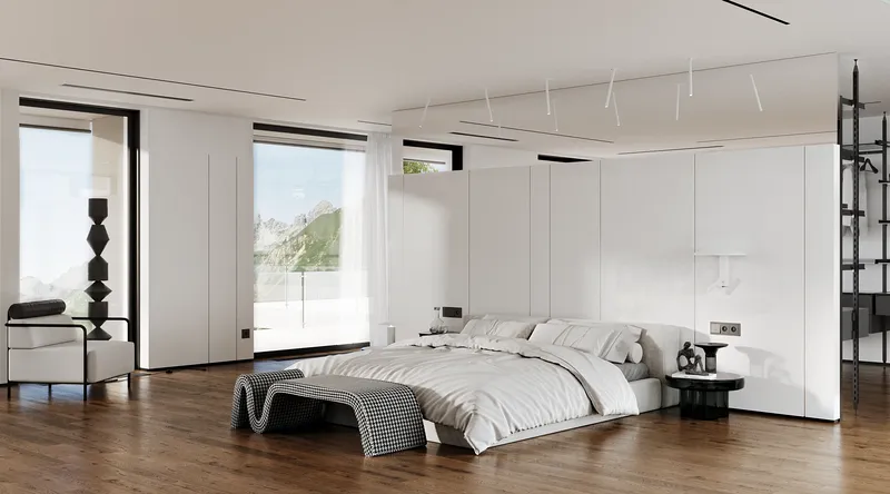 Geräumiges, modernes Schlafzimmer mit einem Hauptbett, einer gemütlichen Leseecke und dem Zugang zu einem begehbaren Kleiderschrank.