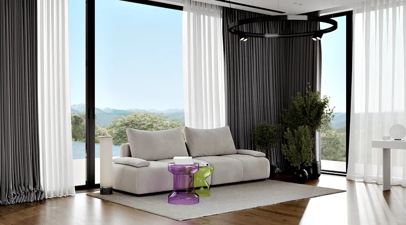 Helles Gästezimmer mit einem bequemen modernen Sofa neben einem großen Fenster.