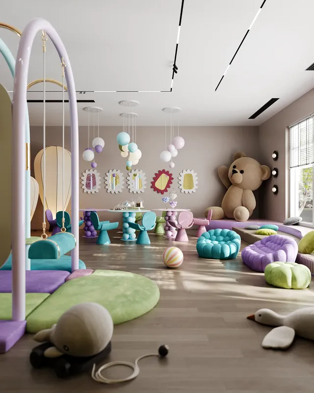 Grande zone de jeux douce dans un centre pour enfants, comprenant un mur d'escalade, des jouets colorés et des fauteuils moelleux.