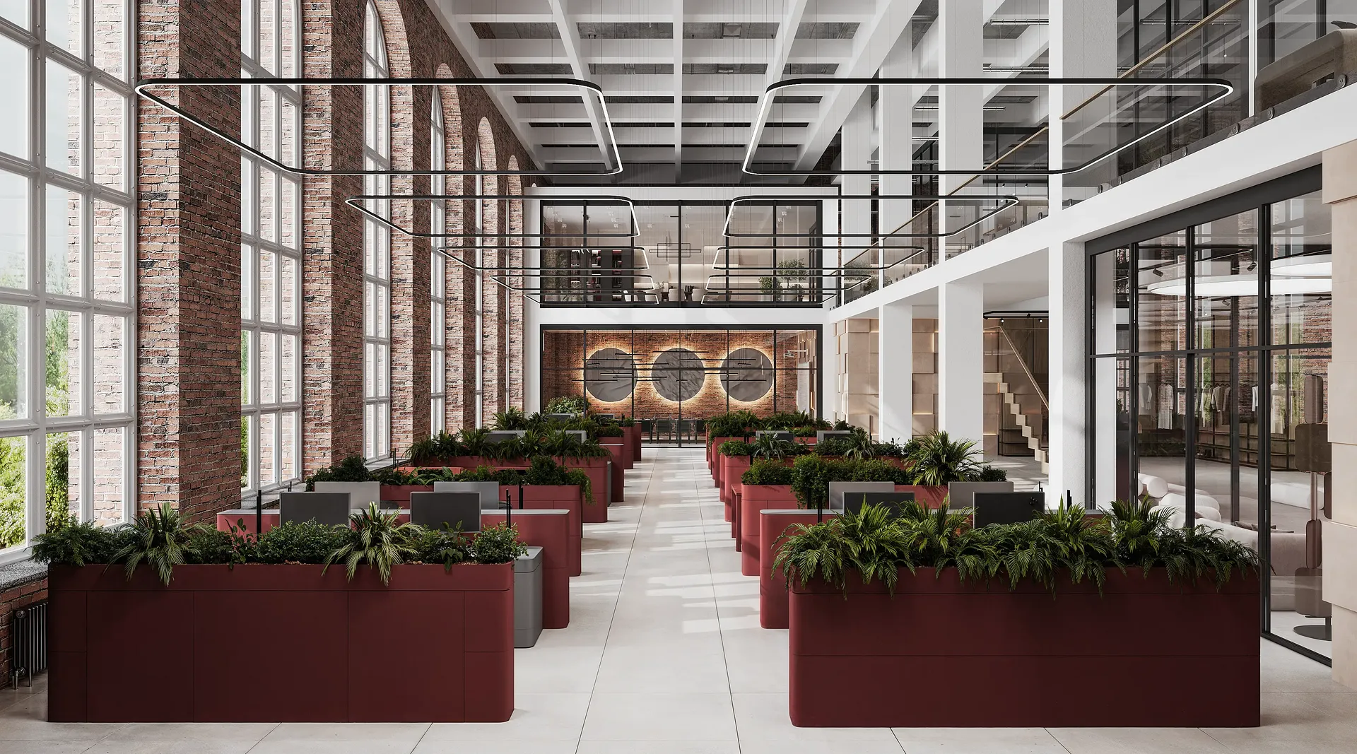 Bright open-plan office with partitioned workstations, high windows, and staircase to the mezzanine.