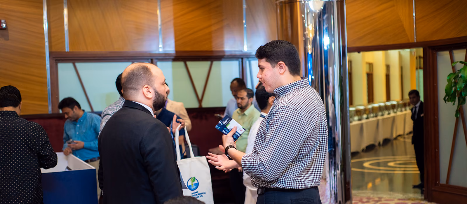 Attendees networking at a corporate event managed by Blues N Coppers