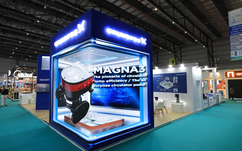 Exhibition stand with dark blue branding, designed by Blues N Coppers