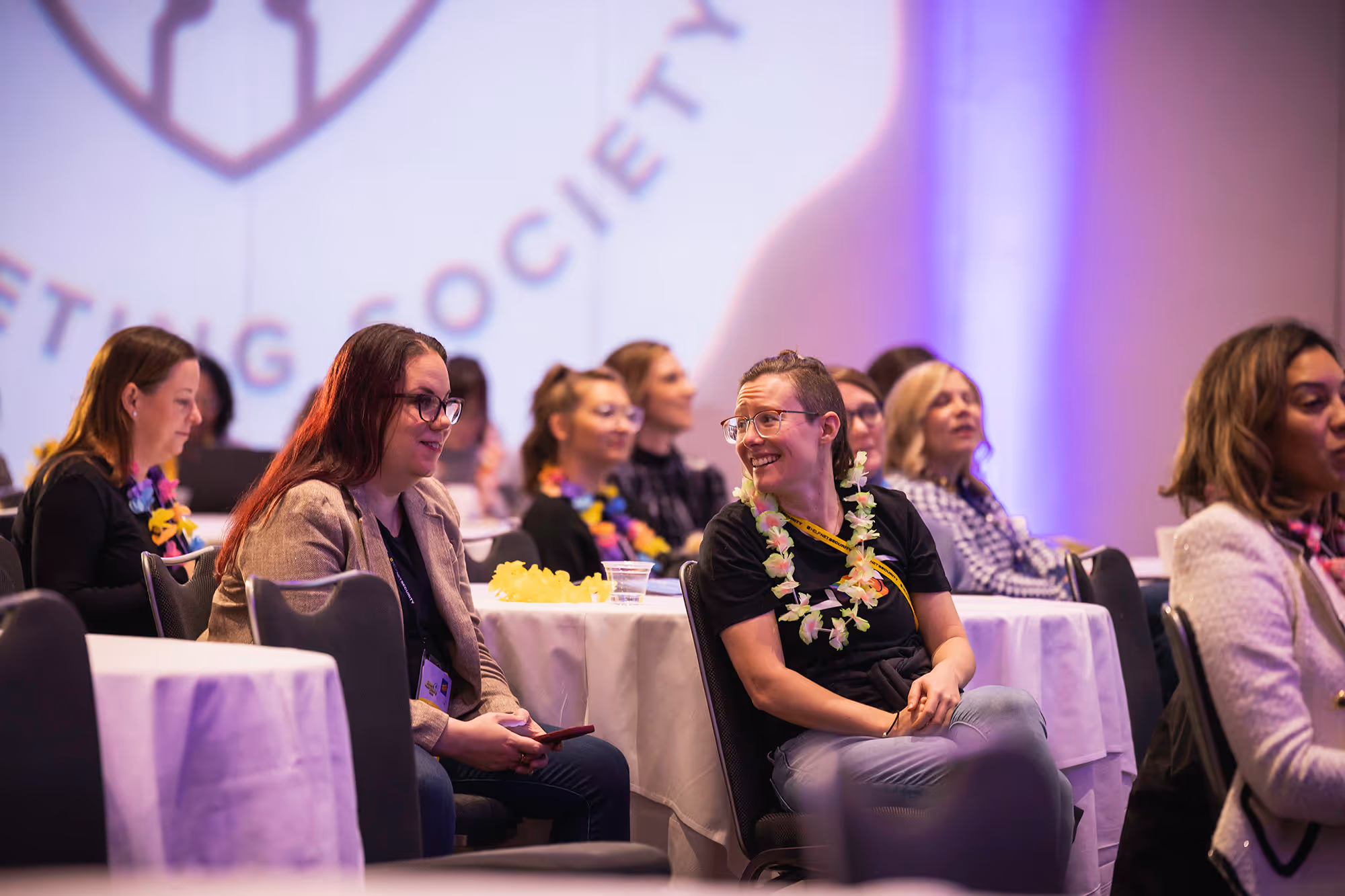 People sitting around a table in a conference hall