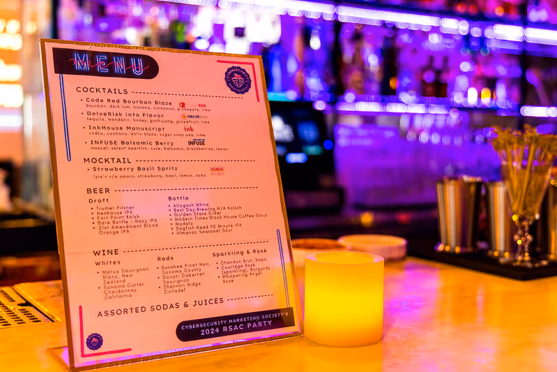 Menu on table in a bar with candle beside it