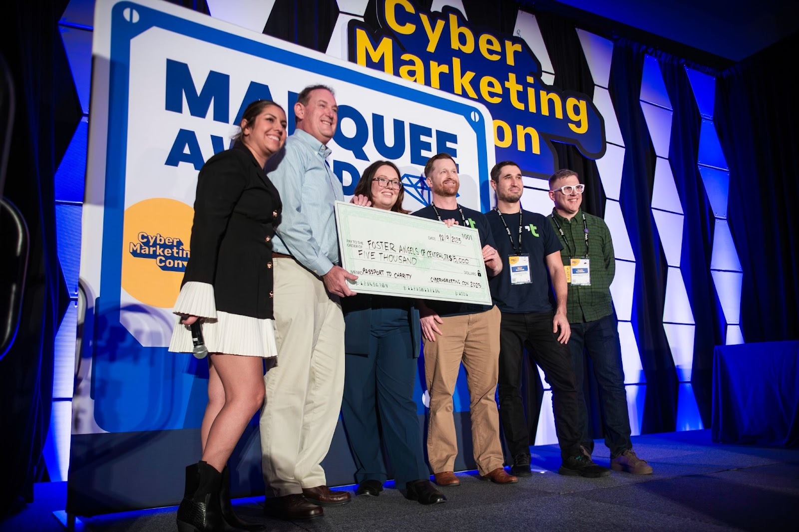 CyberEdge Group making a charitable donation at CyberMarketingCon 2025
