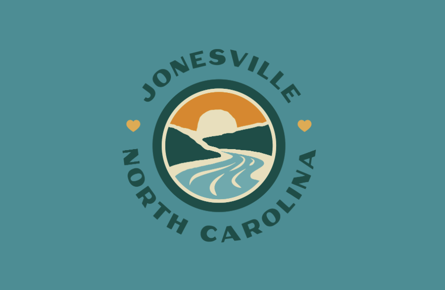 Scenic view of downtown Jonesville, NC with mountains in the background and the Yadkin River flowing nearby