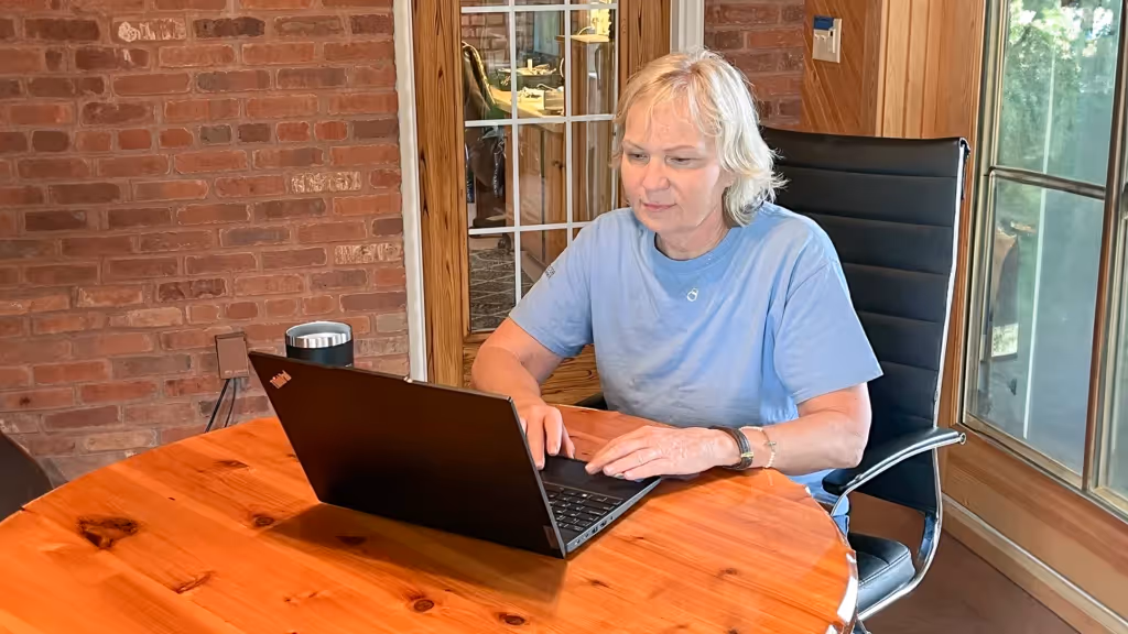 Julie On Laptop House