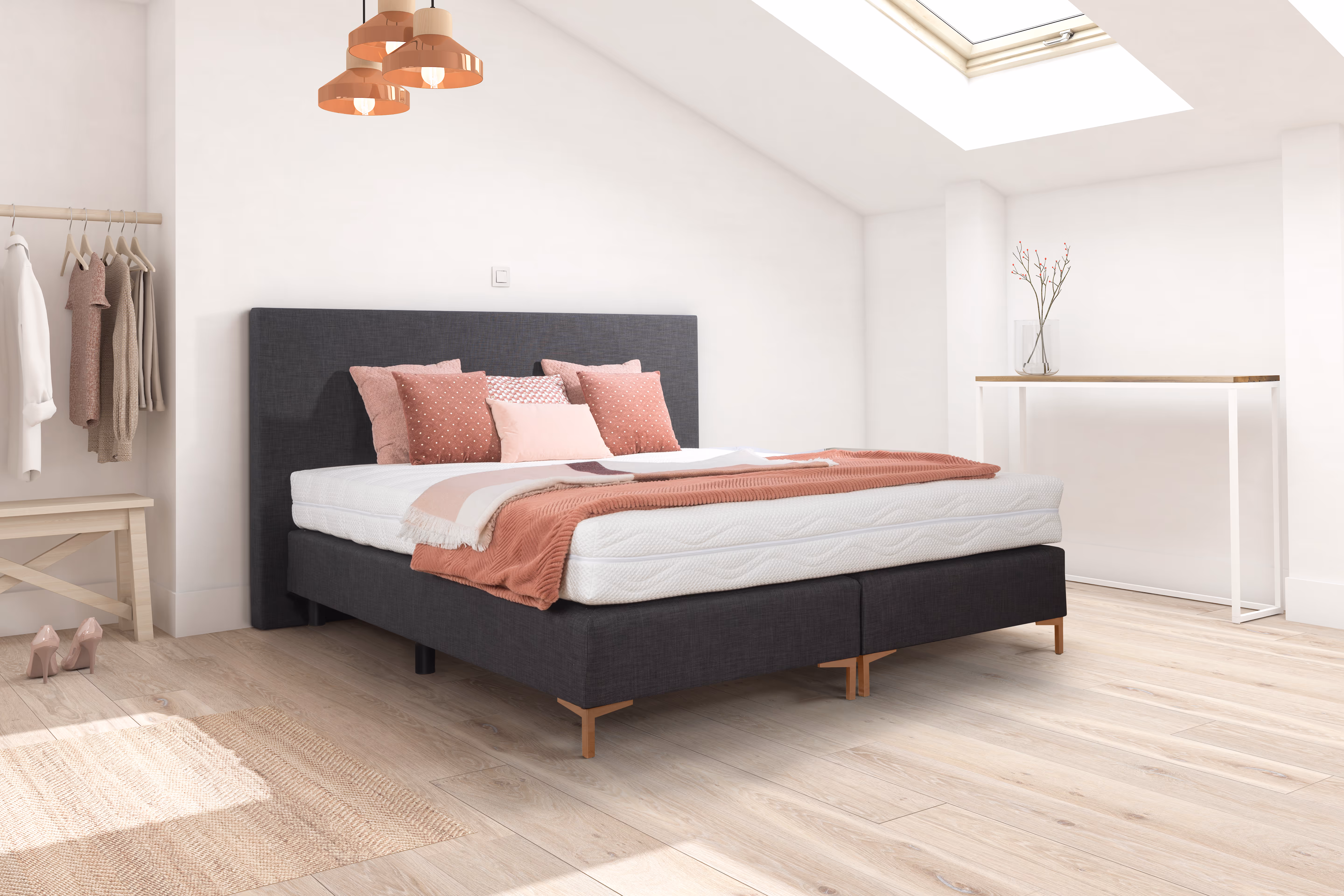 Boxspring van Vanlandschoot met matras, volledig opgemaakt.