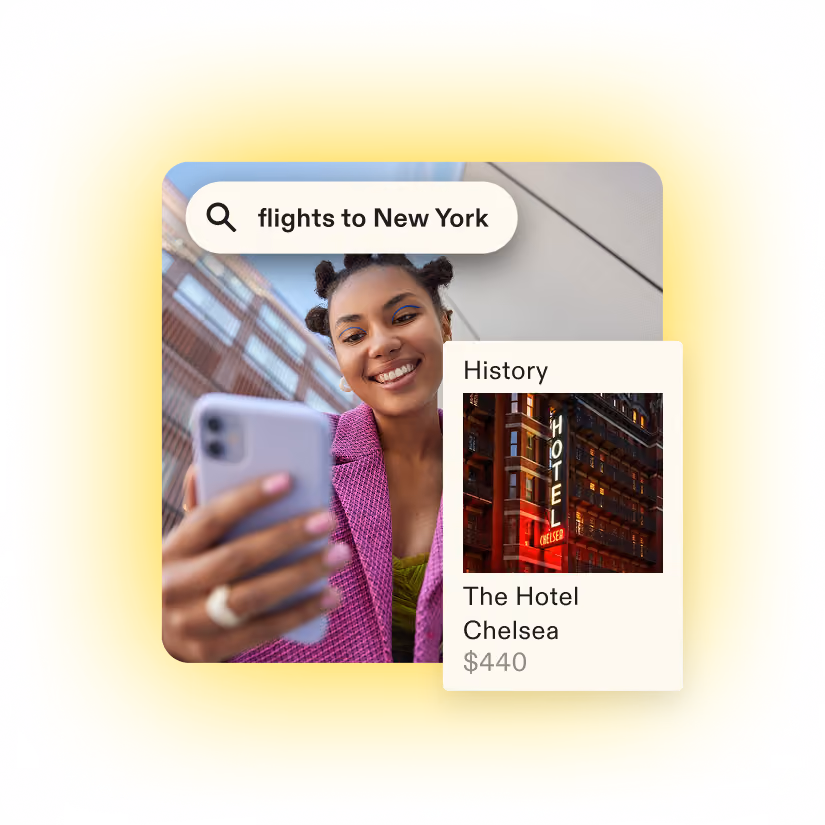 Woman smiling while holding smartphone with search for flights to New York and hotel info.