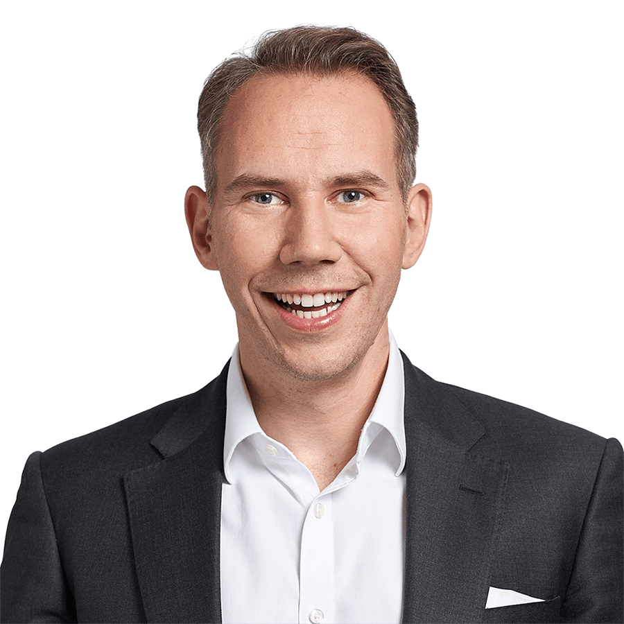 A headshot of Jens Schefzig facing the camera and smiling.