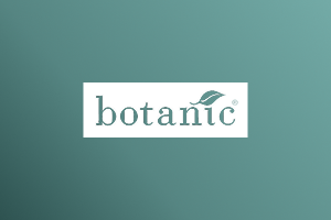 White Botanic logo on Marigold color gradient