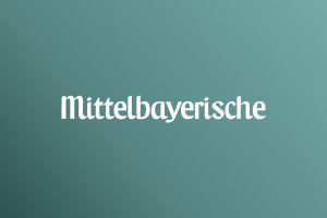 Mittelbayerischer logo in white on Marigold gradient background