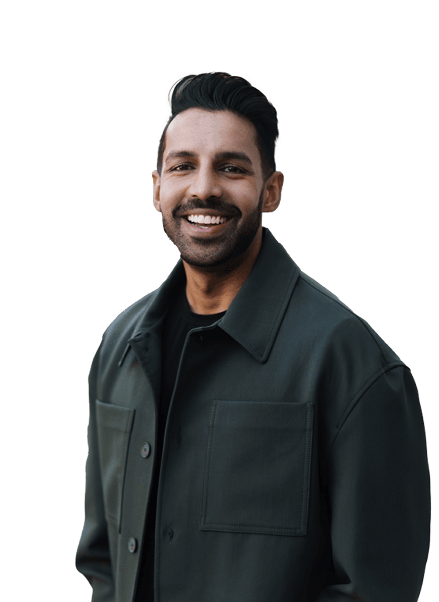 Smiling man in dark jacket looking confident and cheerful