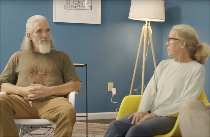 Groups member and counselor talking in a Groups office