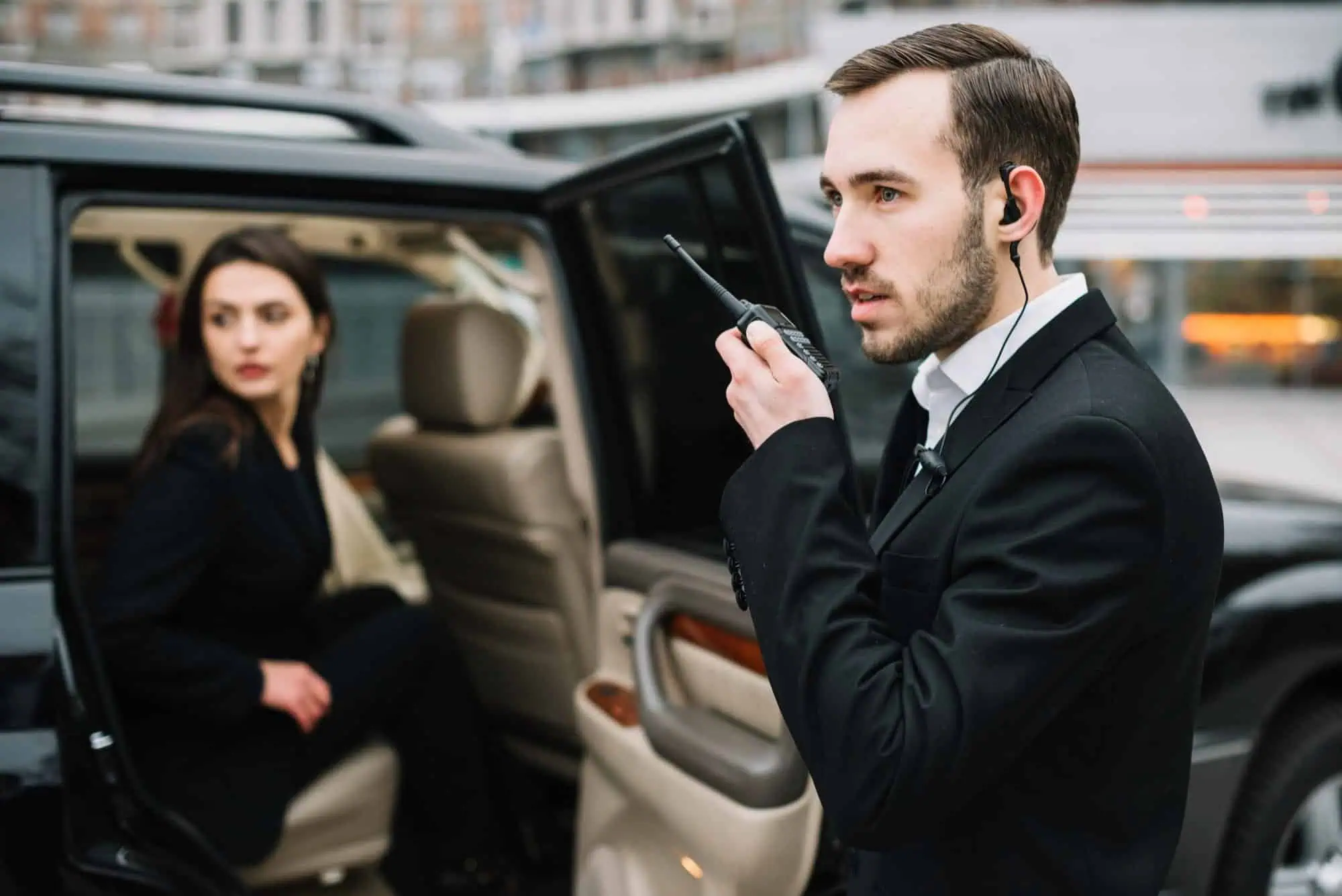 Security Man protecting woman