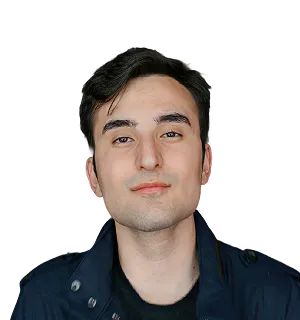 Portrait of a young man with short dark hair wearing a dark collared shirt.