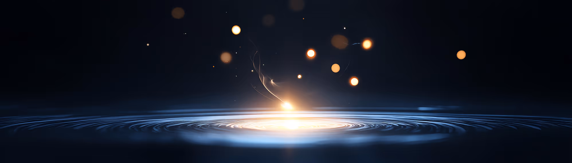 Glowing golden particles above rippling water on a dark background.