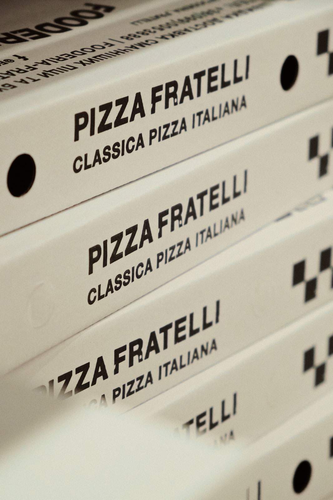 Photo of a pizza box. Branding and Packaging