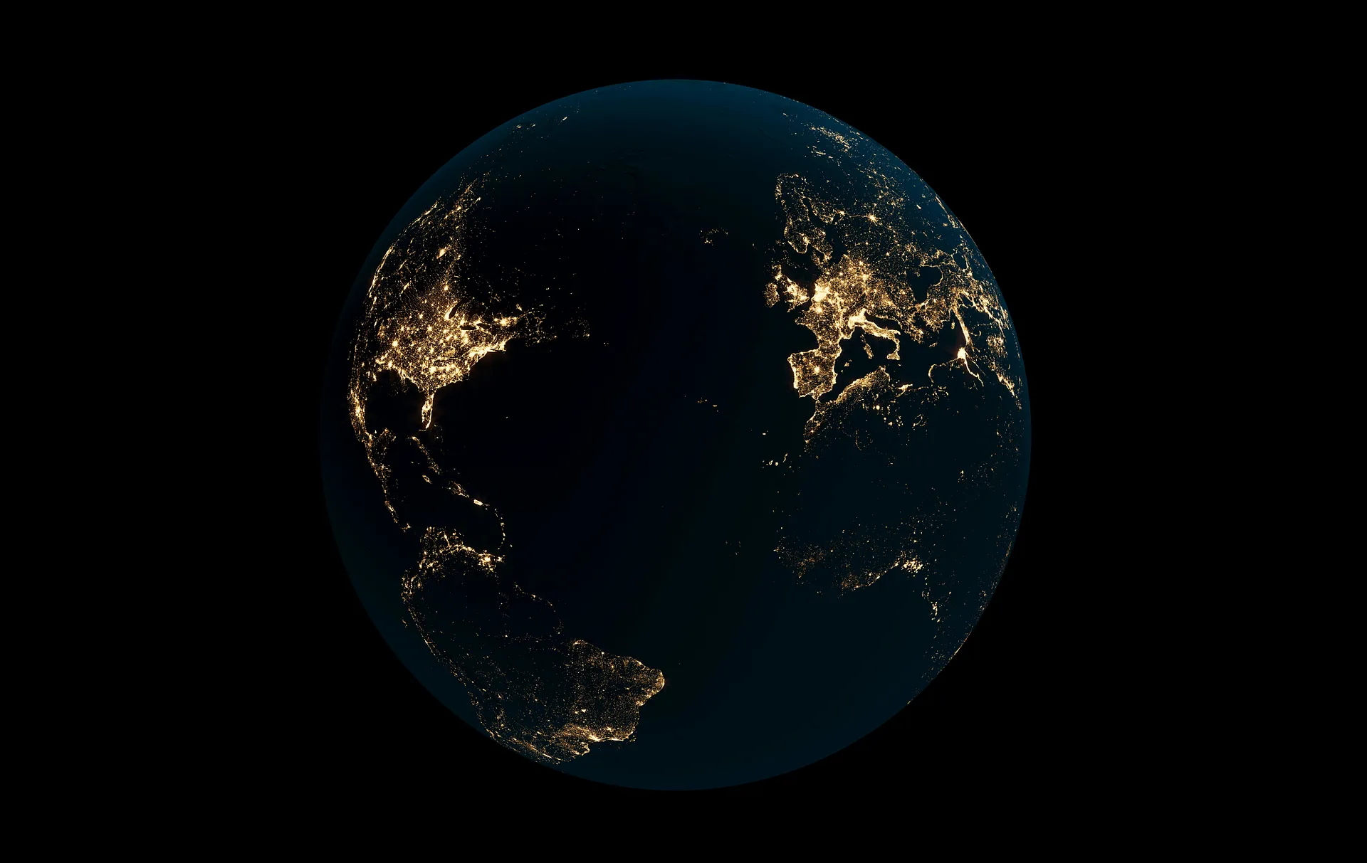 View of Earth at night showing illuminated cities across North America, Europe, and Africa
