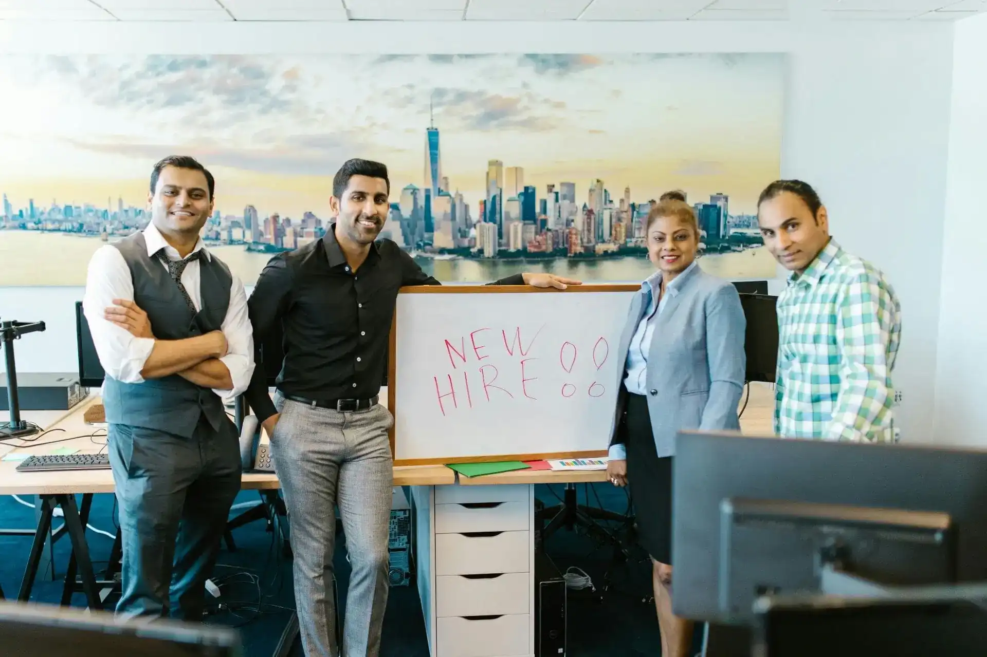 HR leaders welcoming a new international employee during global workforce expansion and cross-border hiring.