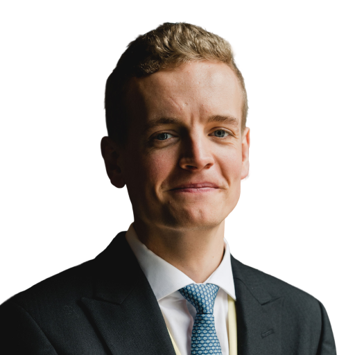 A photo of a smiling man with blonde hair